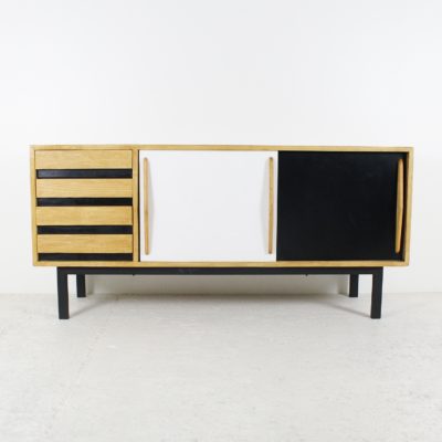 Vintage sideboard with sliding doors and drawers, in ash, laminate and black lacquered metal, for the Cansado housing estate, by Charlotte Perriand, Steph Simon edition, late 1950s.