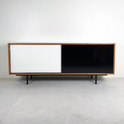 Vintage 1960s sideboard in cherry wood with sliding Formica doors. Florence Knoll.