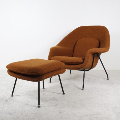 Vintage &quot;Womb Chair&quot; armchair and ottoman, black metal and fabric, by Eero Saarinen for Knoll, 1960s.