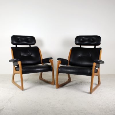 Pair of 1960's vintage Danish armchairs in wood and black leather.