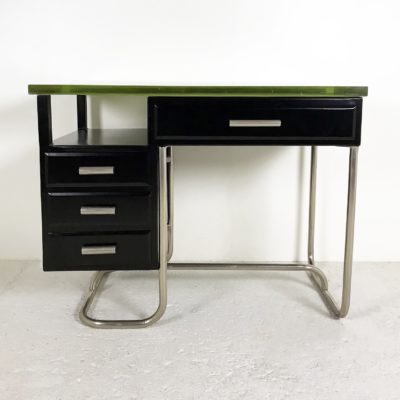 Modernist Art Deco desk, from the 30's, in black lacquered metal, tubular base in chromed metal, thick slab of glass cast on Boussois sand serving as a top.