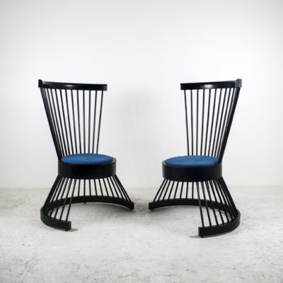 Vintage armchairs with black lacquered wood bars, work from the 1950s.