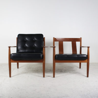 Vintage Danish armchairs, 1950s, by Grete Jalk, in teak and original black leather cushions.