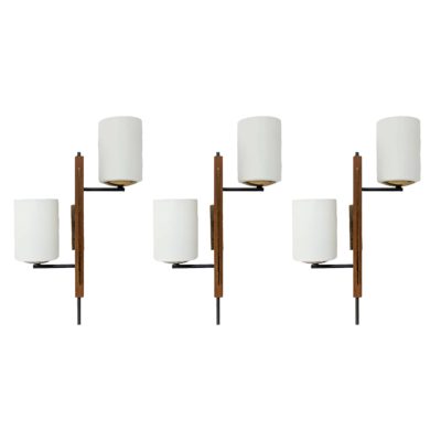 Set of three sconces, French edition Arlus, in opaline, teak and brass, 1950s.